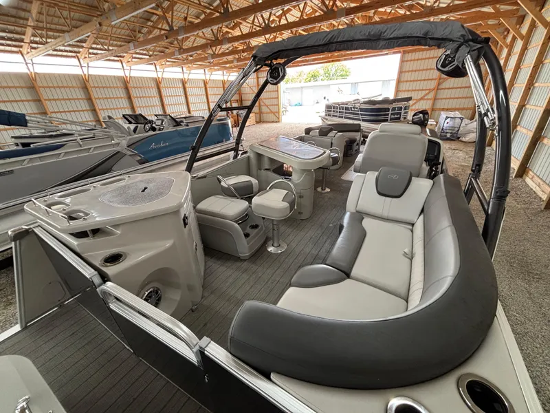 Slide: The Image of 2021 Avalon Catalina Entertainer 25' pontoon boat interior with seating and table. - 11