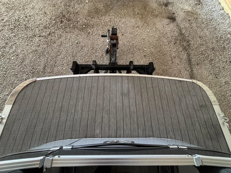 Slide: The Image of 2021 Avalon Catalina Entertainer boat on trailer, top view, gravel background. - 13