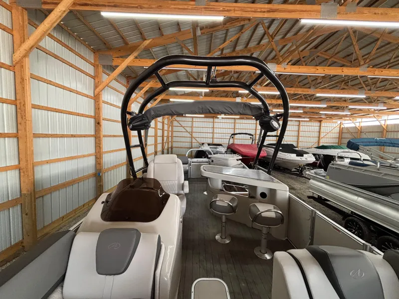 Slide: The Image of 2021 Avalon Catalina Entertainer 25' pontoon boat in storage facility. - 14