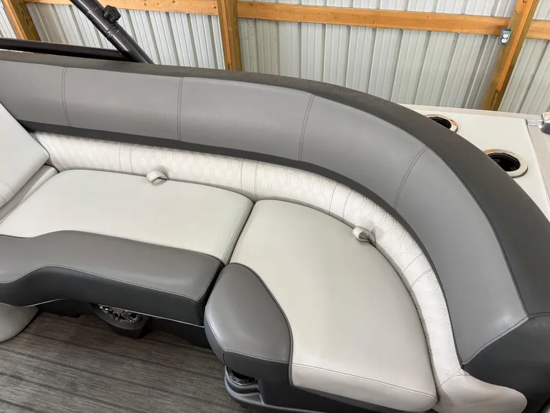 Slide: The Image of 2021 Avalon Catalina Entertainer boat seating, gray and white upholstery, cup holders visible. - 16