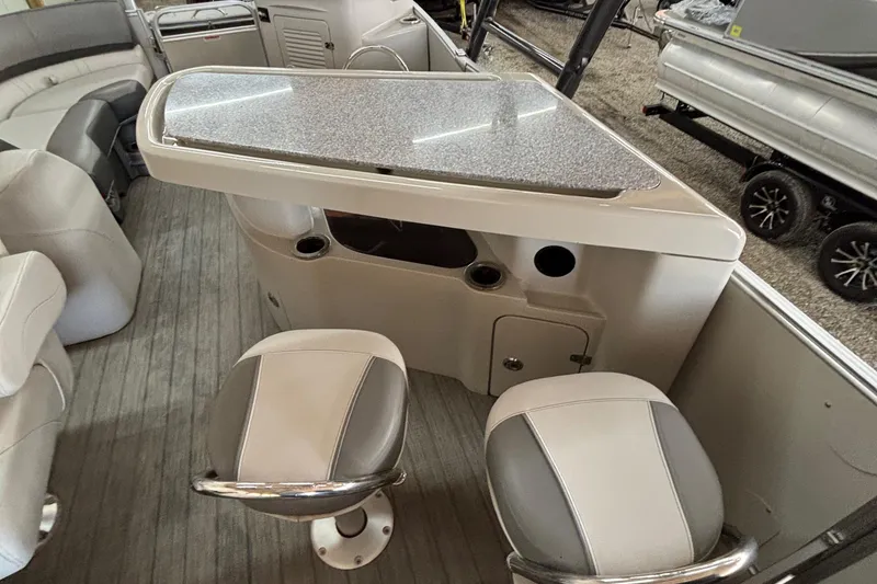 Slide: The Image of 2021 Avalon Catalina Entertainer boat interior with bar and seating area. - 21