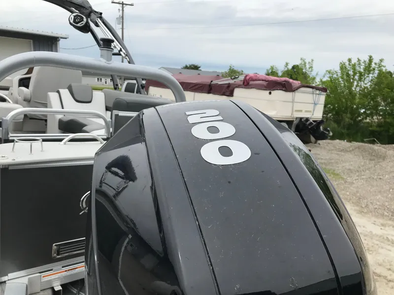 Slide: The Image of 2021 Avalon Catalina Entertainer 25' boat with a 200 HP outboard motor. - 3