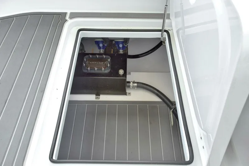 Slide: The Image of Freeman 47T 2022 boat compartment with mechanical components and hoses. - 10