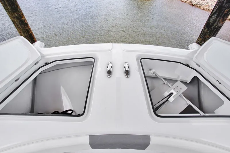 Slide: The Image of 2022 Freeman 47T boat storage compartments open, showcasing anchor and equipment. - 12