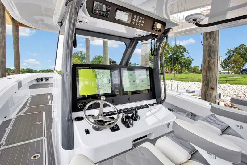 Slide: The Image of 2022 Freeman 47T boat cockpit with advanced navigation system and sleek design. - 15