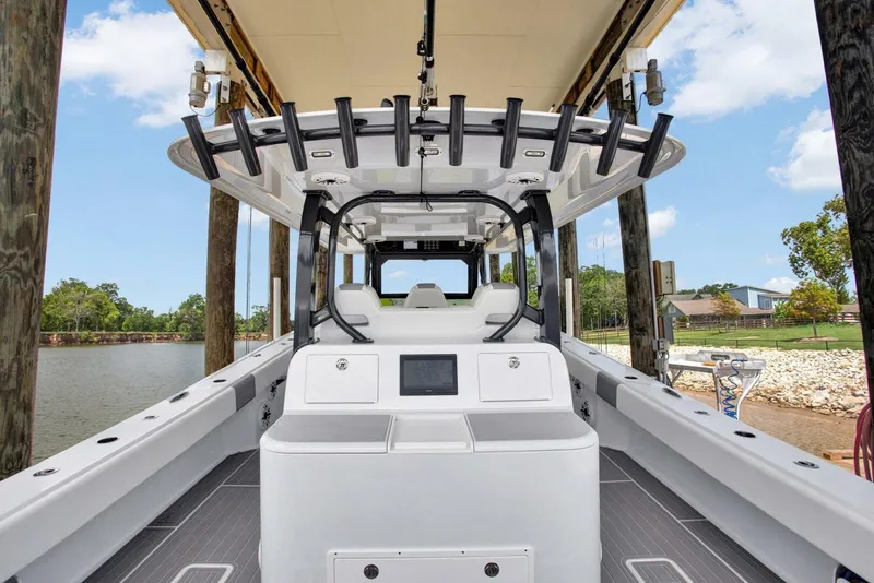 Slide: The Image of 2022 Freeman 47T boat docked, showcasing spacious deck and modern design. - 22