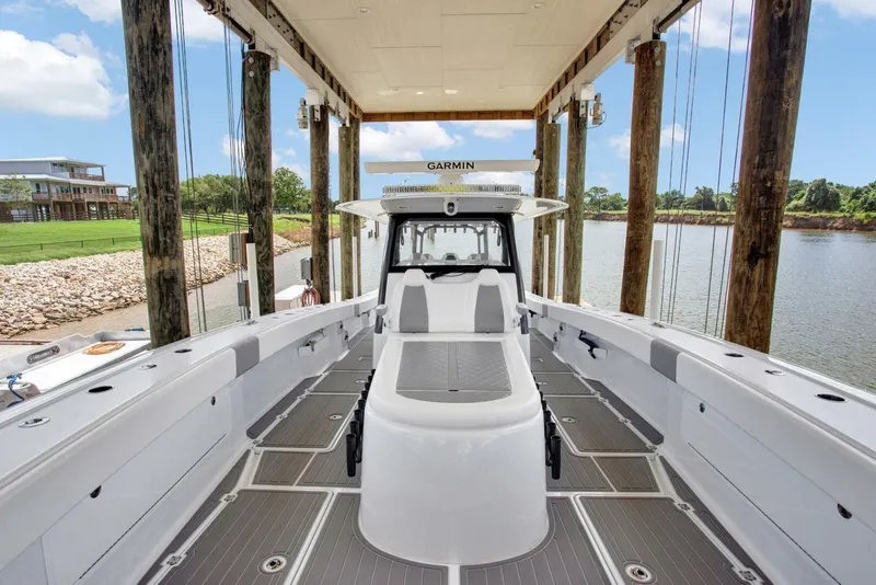 Slide: The Image of 2022 Freeman 47T boat docked, featuring spacious deck and modern design. - 36