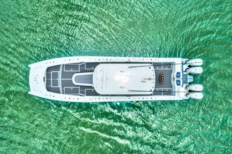 Slide: The Image of Aerial view of 2022 Freeman 47T boat on vibrant green water. - 4