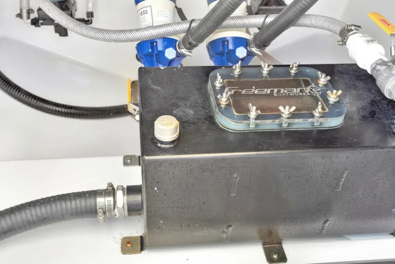 Slide: The Image of Freeman 47T 2022 model component with hoses and connectors in a mechanical setup. - 46