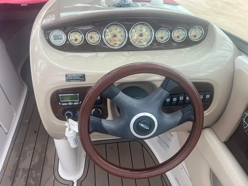 Slide: The Image of 2006 Chaparral Sunesta 254 dashboard with steering wheel and gauges. - 10