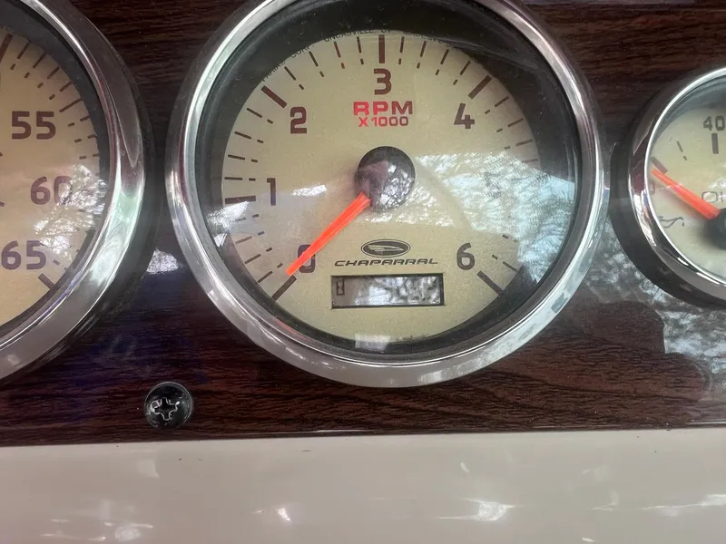 Slide: The Image of 2006 Chaparral Sunesta 254 RPM gauge with wood paneling. - 11