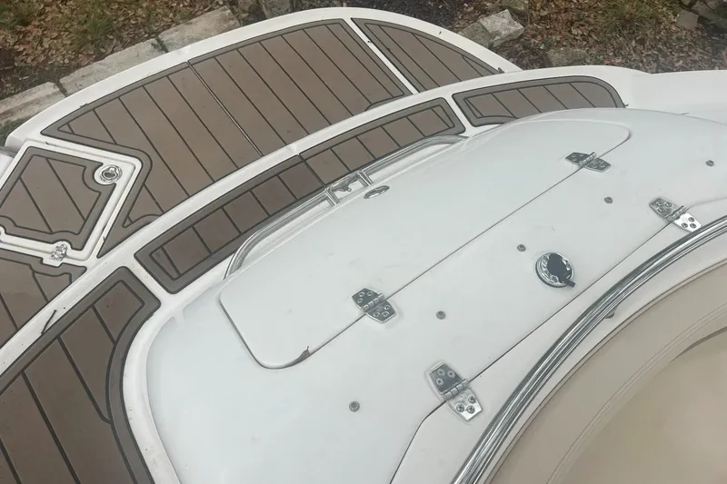Slide: The Image of 2006 Chaparral Sunesta 254 boat deck with brown and white detailing. - 17