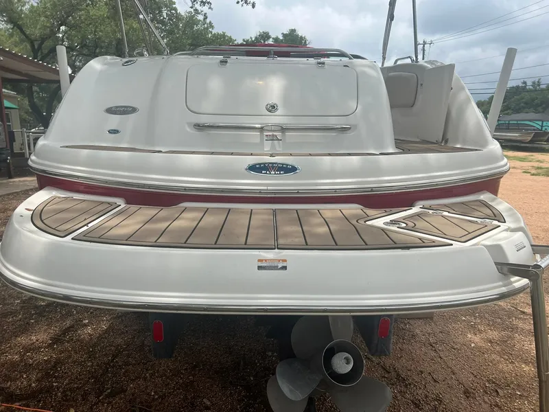 Slide: The Image of 2006 Chaparral Sunesta 254 boat, rear view with swim platform and propeller. - 18