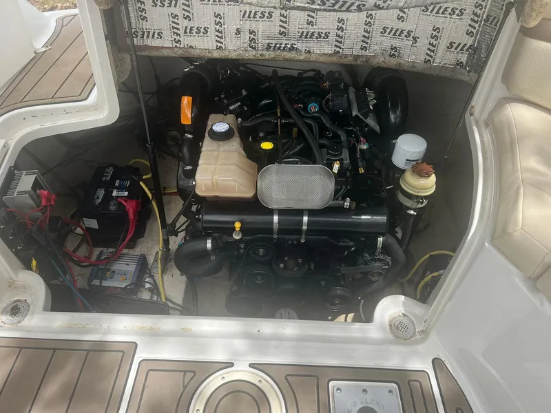 Slide: The Image of 2006 Chaparral Sunesta 254 engine compartment with visible components and wiring. - 19