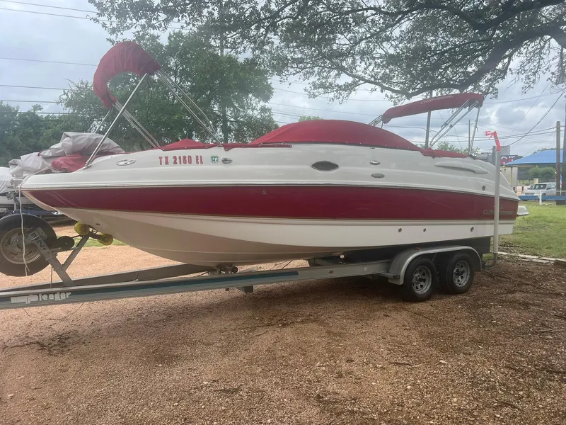 Slide: The Image of 2006 Chaparral Sunesta 254 boat on trailer with red canopy and accents. - 5