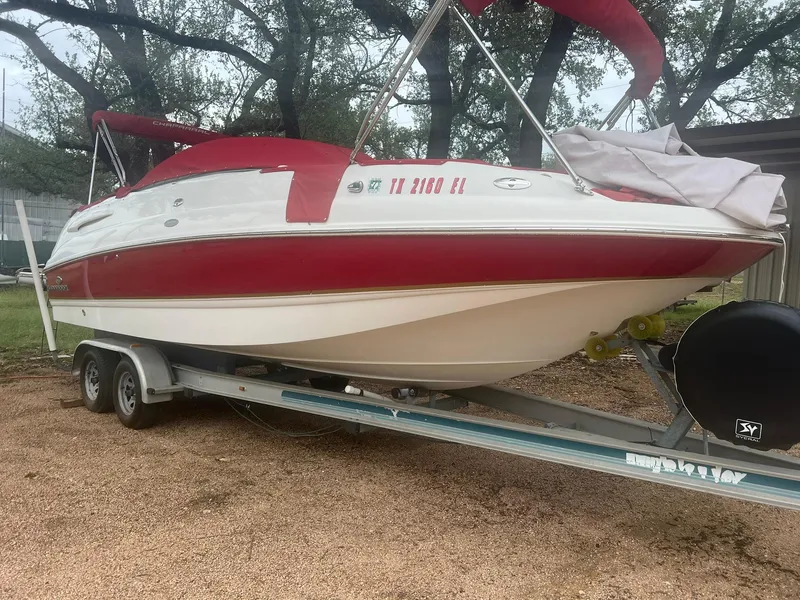 Slide: The Image of 2006 Chaparral Sunesta 254 boat on trailer with red and white design. - 6