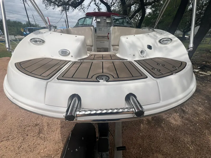Slide: The Image of 2006 Chaparral Sunesta 254 boat with spacious deck and seating area. - 7