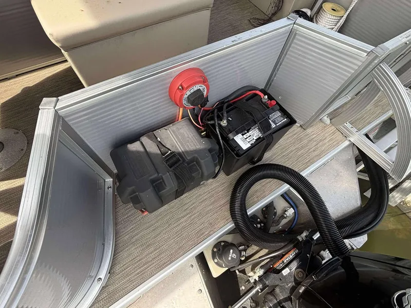 Slide: The Image of 2019 Misty Harbor 2085 Adventure CF boat battery compartment with wiring and engine components. - 13