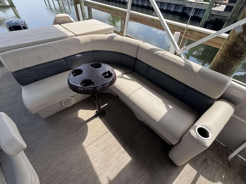 Slide: The Image of 2019 Misty Harbor 2085 Adventure CF pontoon boat interior with cushioned seating and cup holders. - 15