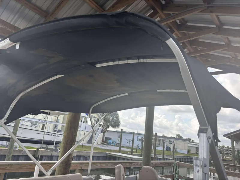 Slide: The Image of 2019 Misty Harbor 2085 Adventure CF boat under a covered dock. - 16
