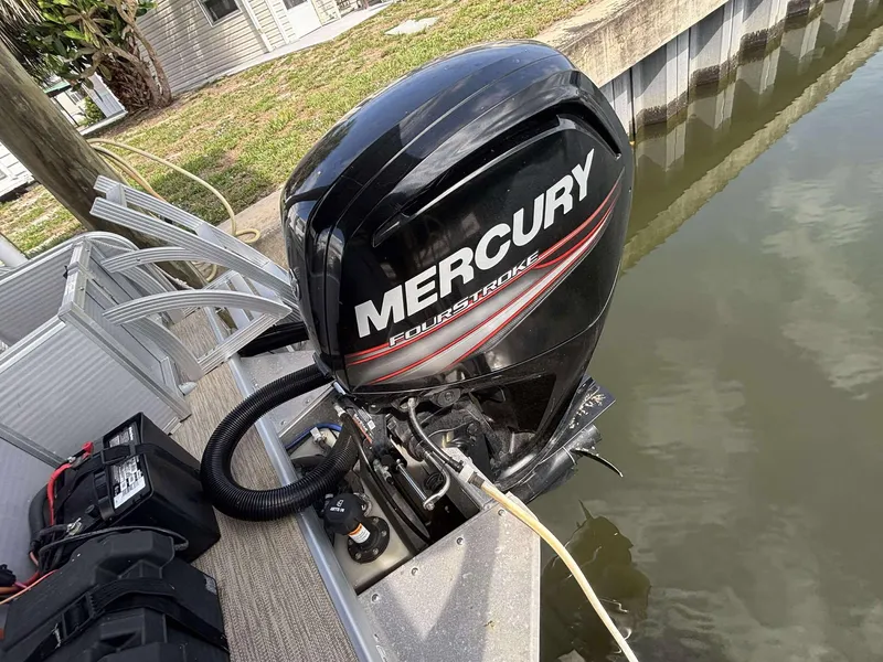 Slide: The Image of 2019 Misty Harbor 2085 Adventure CF with Mercury outboard motor by a dock. - 17