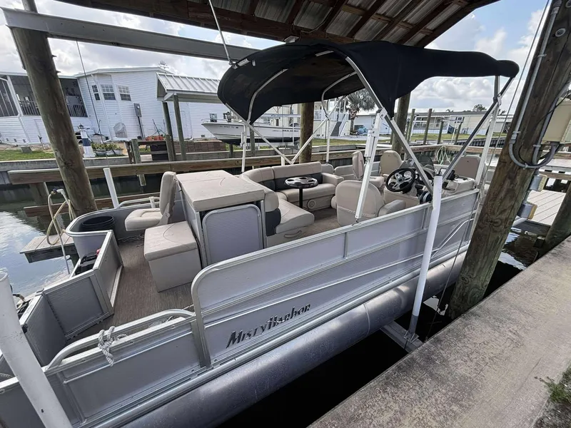 Slide: The Image of 2019 Misty Harbor 2085 Adventure CF pontoon boat docked under a covered marina. - 2