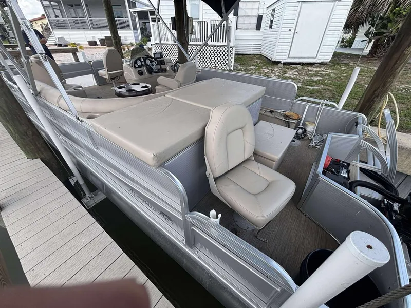Slide: The Image of 2019 Misty Harbor 2085 Adventure CF pontoon boat with beige seating, docked near a wooden pier. - 5