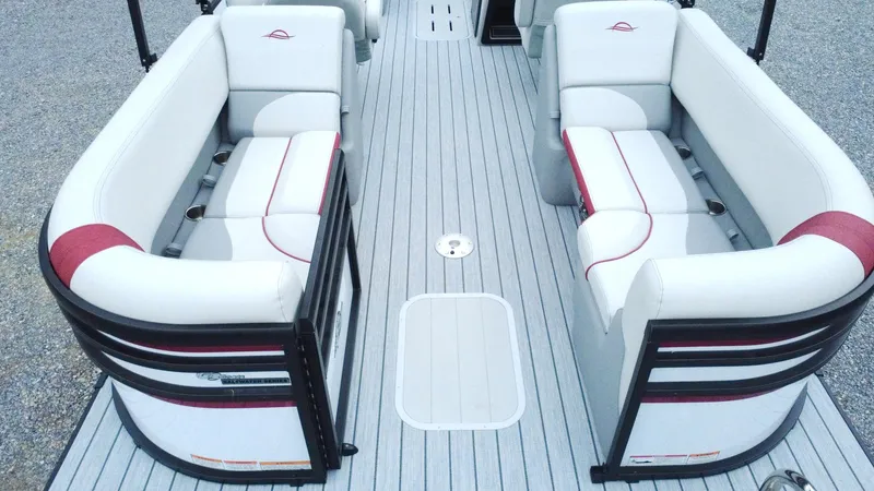 Slide: The Image of 2025 SunCatcher Select 322RC pontoon boat interior with white and red seating. - 11
