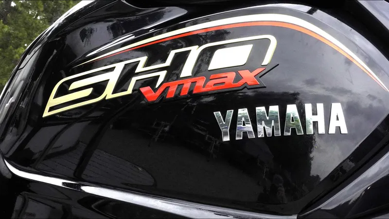 Slide: The Image of Close-up of Yamaha SHO VMAX logo on a sleek black surface, 2025 SunCatcher Select 322RC. - 12