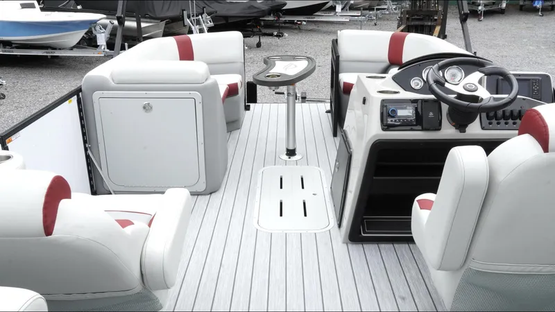 Slide: The Image of 2025 SunCatcher Select 322RC pontoon boat interior with modern seating and control console. - 16