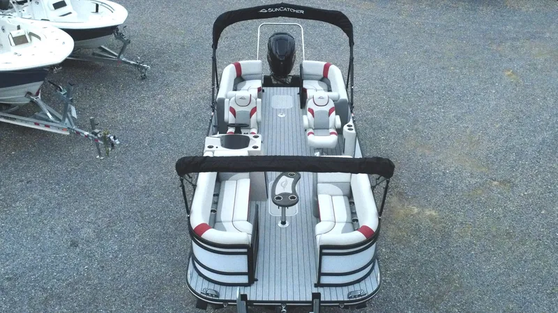 Slide: The Image of 2025 SunCatcher Select 322RC pontoon boat with spacious seating and modern design. - 2