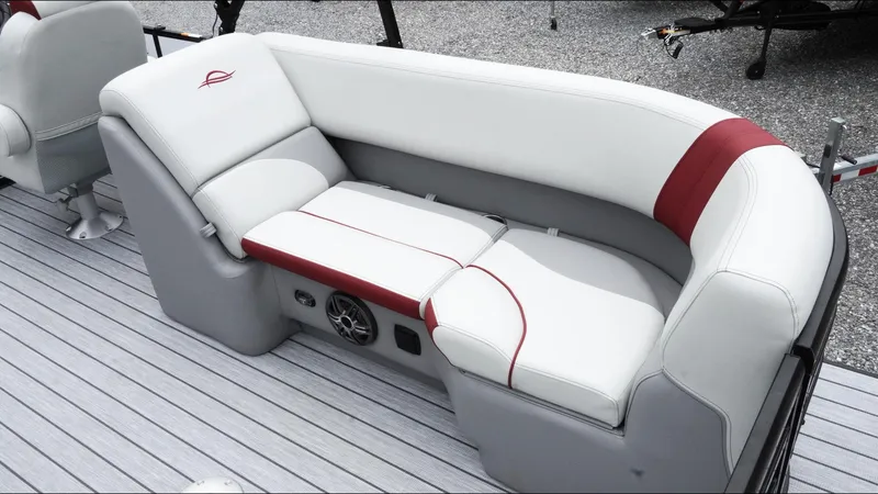 Slide: The Image of Luxurious seating on 2025 SunCatcher Select 322RC boat, featuring white and red upholstery. - 22