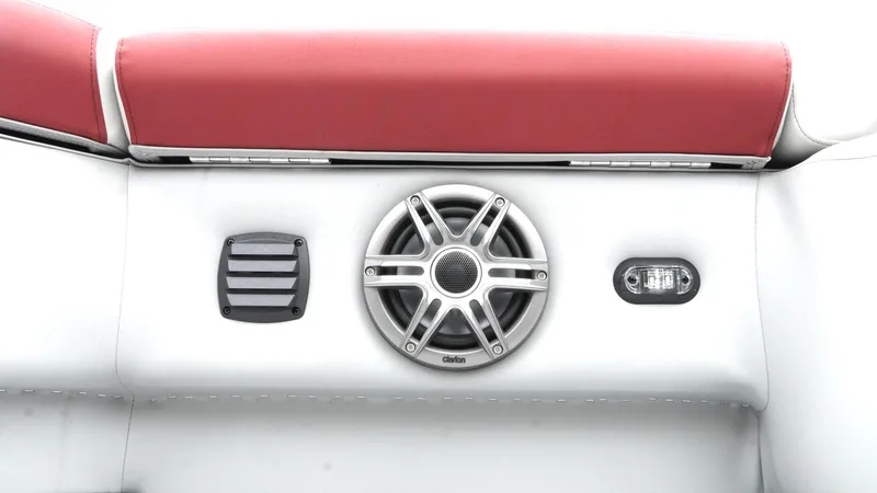 Slide: The Image of 2025 SunCatcher Select 322RC boat interior with speaker and red upholstery. - 24