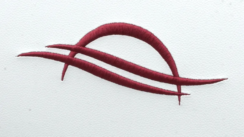 Slide: The Image of Red embroidered logo on white background, representing SunCatcher Select 322RC, 2025 model. - 26