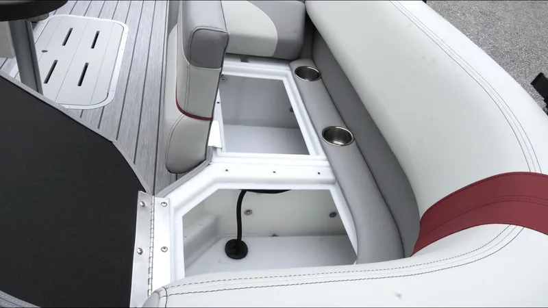 Slide: The Image of Interior seating and storage of 2025 SunCatcher Select 322RC boat with cup holders. - 30