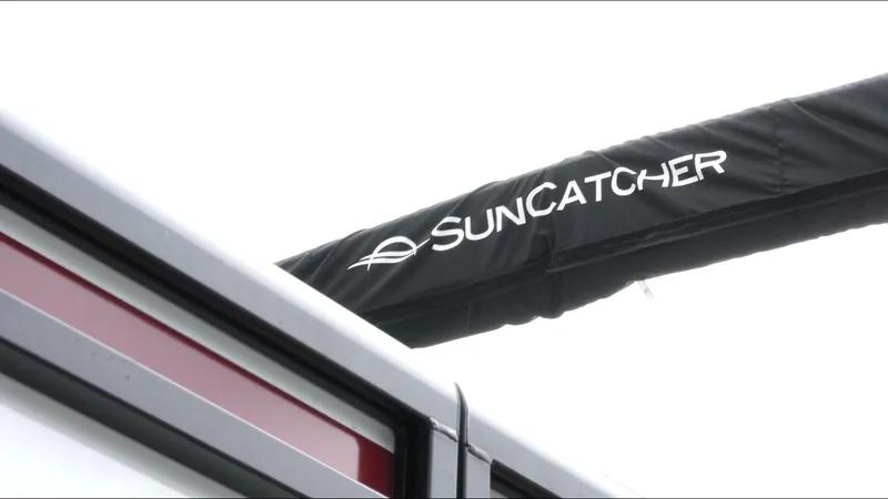 Slide: The Image of 2025 SunCatcher Select 322RC boat canopy with logo. - 9