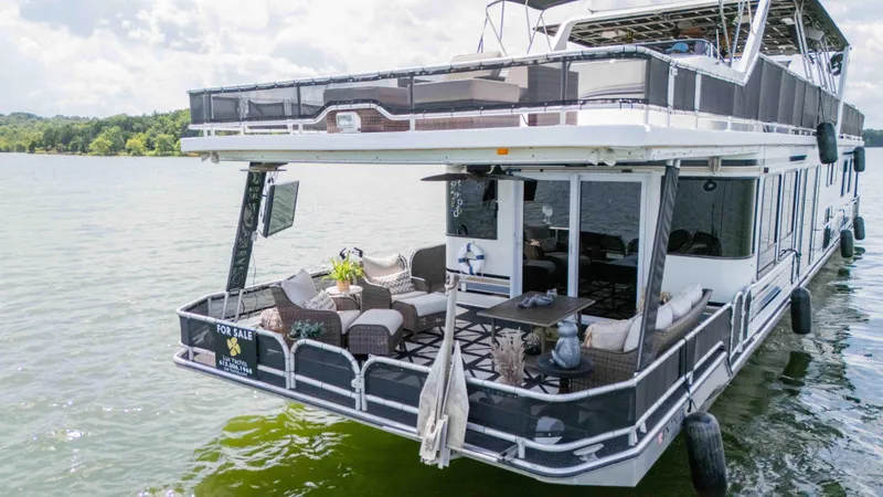 Slide: The Image of 1998 Sumerset houseboat with furnished deck, for sale on a serene lake. - 12