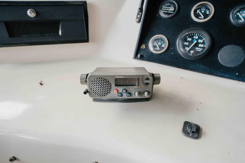 Slide: The Image of Control panel of a 1998 Sumerset houseboat with radio and gauges. - 36