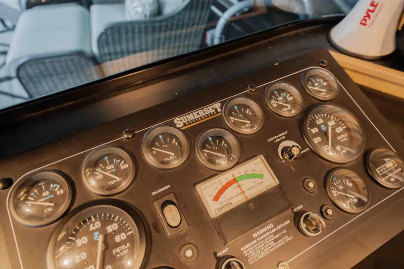 Slide: The Image of 1998 Sumerset houseboat dashboard with gauges and controls. - 37