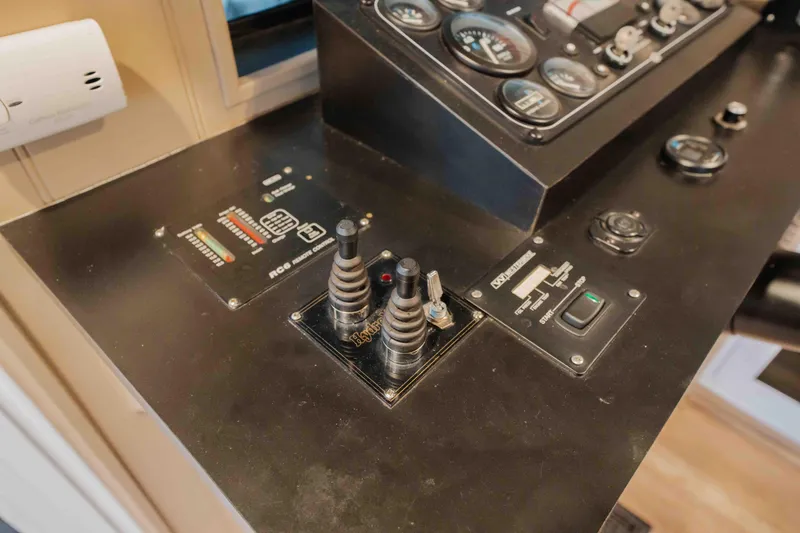 Slide: The Image of Control panel of a 1998 Sumerset houseboat with gauges and switches. - 38