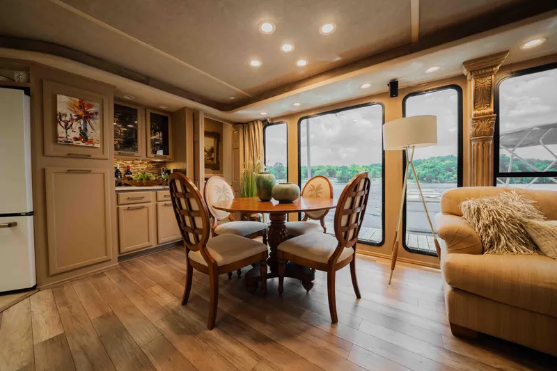 Slide: The Image of Luxurious 1998 Sumerset houseboat interior with elegant dining area and scenic window views. - 40