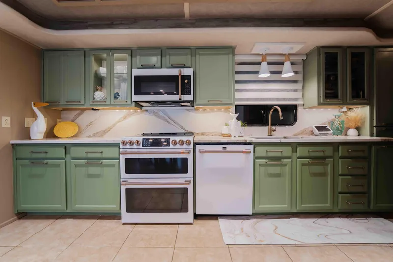Slide: The Image of Modern kitchen in a 1998 Sumerset houseboat with green cabinets and stainless steel appliances. - 45