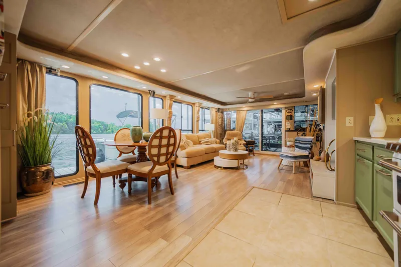 Slide: The Image of Luxurious 1998 Sumerset houseboat interior with elegant furnishings and large windows overlooking the water. - 48