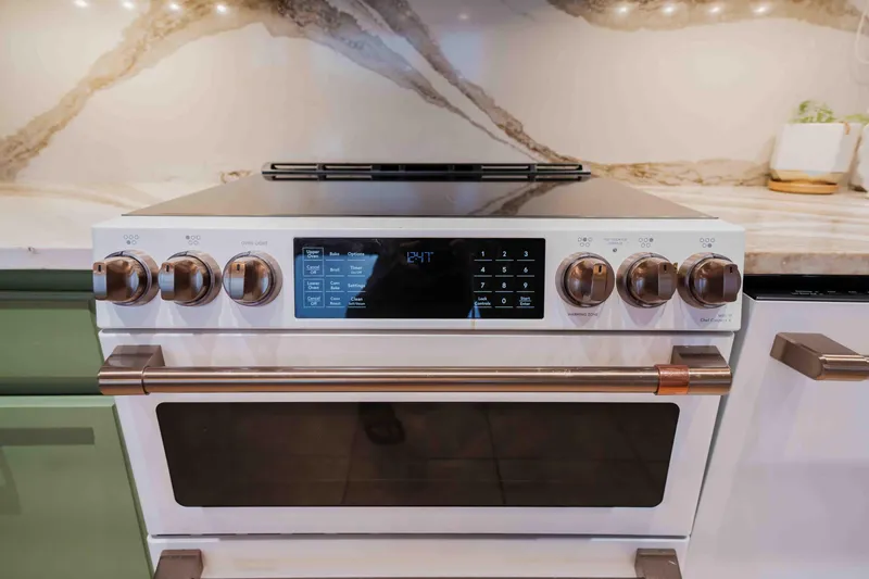 Slide: The Image of Modern oven with digital controls in a 1998 Sumerset houseboat kitchen. - 49