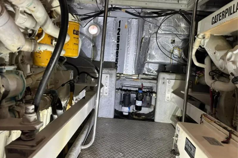 Slide: The Image of Engine room of a 2002 Silverton 43 Motor Yacht with Caterpillar components. - 18