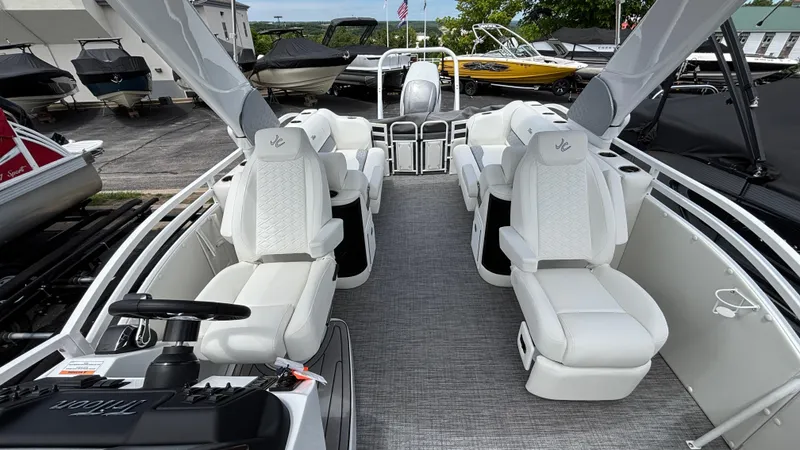 Slide: The Image of Interior of 2025 JC Sporttoon 27TT boat with white seating and modern design. - 12