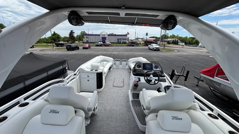 Slide: The Image of 2025 JC Sporttoon 27TT pontoon boat interior with luxurious seating and modern dashboard. - 15