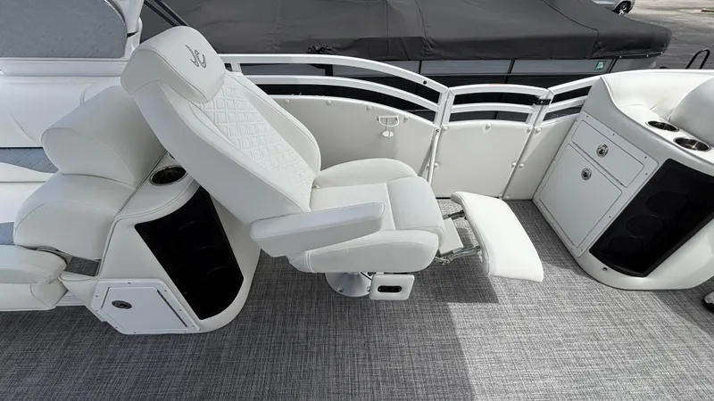 Slide: The Image of Luxurious seating on 2025 JC Sporttoon 27TT boat, featuring reclining chair and modern design. - 18