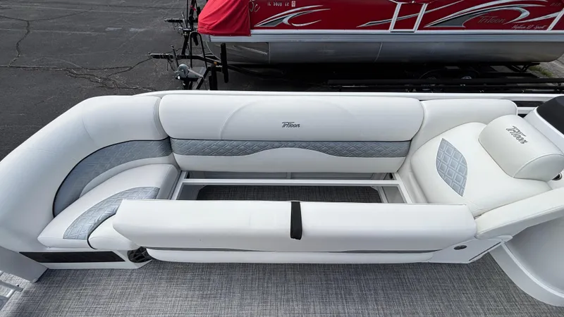 Slide: The Image of Luxurious seating on 2025 JC Sporttoon 27TT pontoon boat, featuring sleek white and gray upholstery. - 26