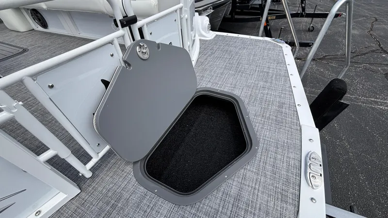 Slide: The Image of Open storage hatch on 2025 JC Sporttoon 27TT boat deck. - 29
